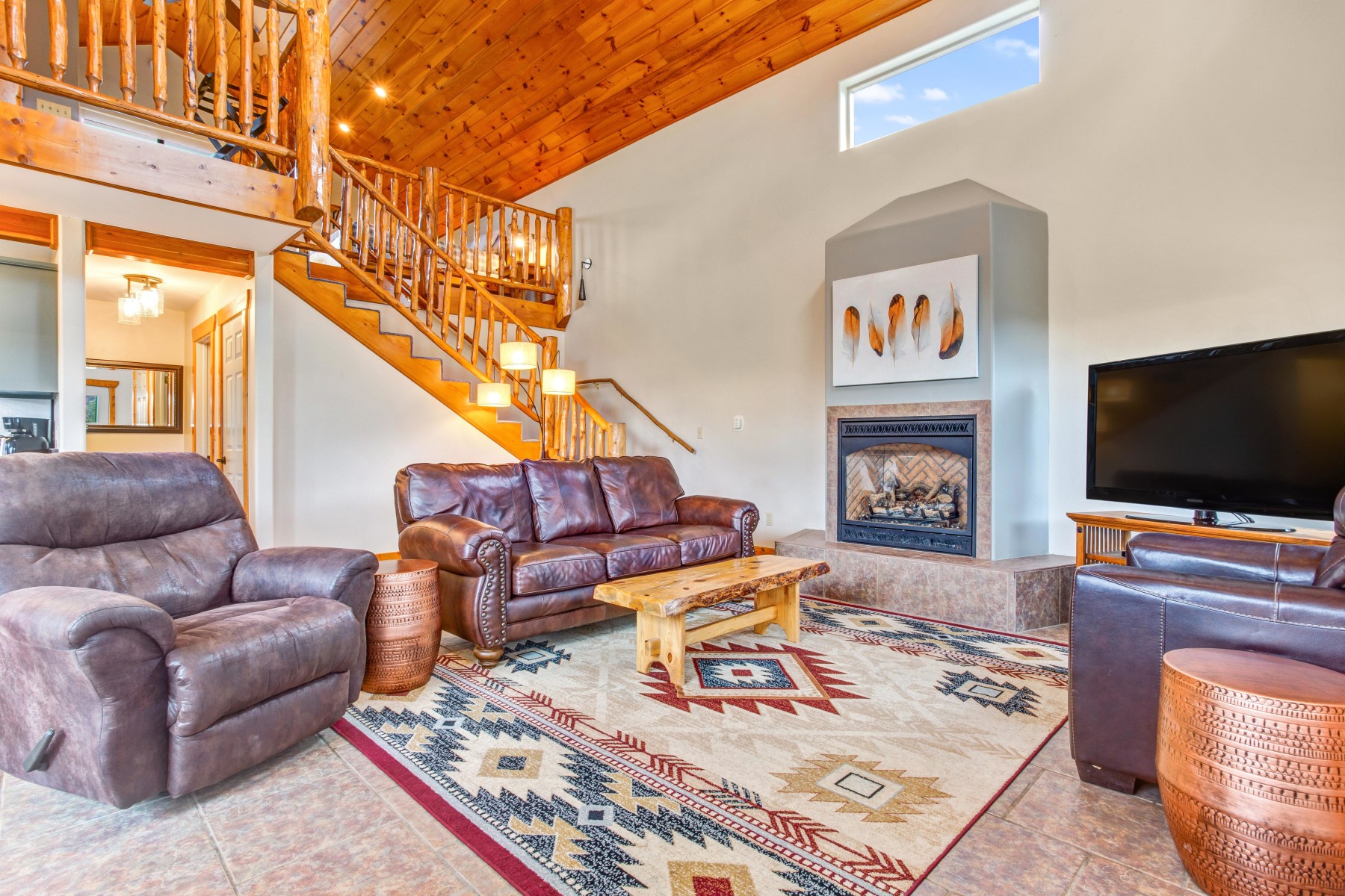 each of our luxury cabins features living/dinging areas and a full kitchen.  photo 7